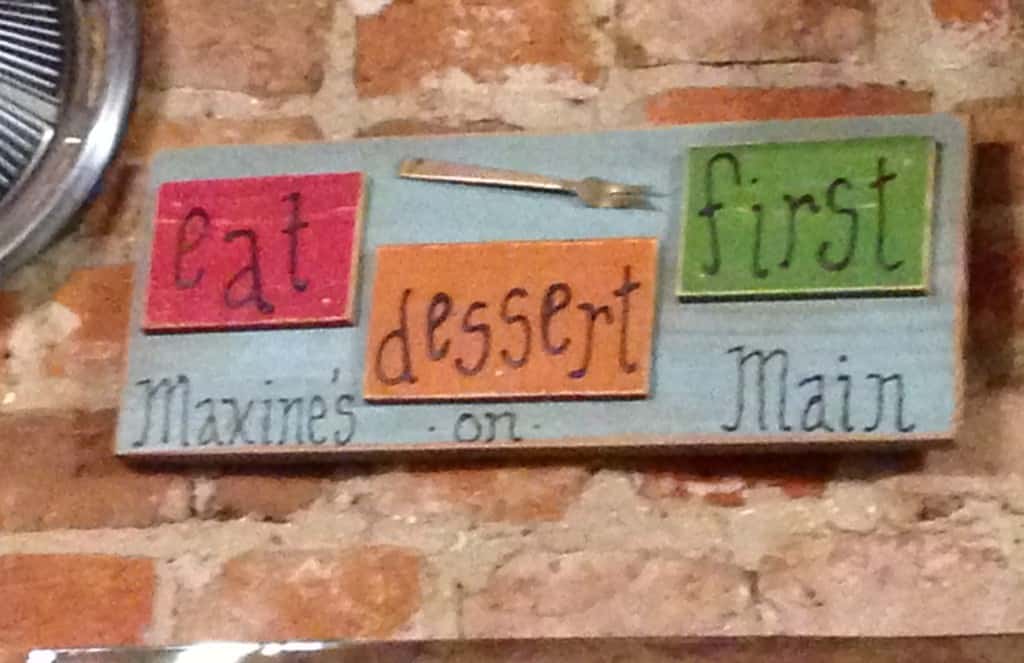 Eat dessert first brown sign board