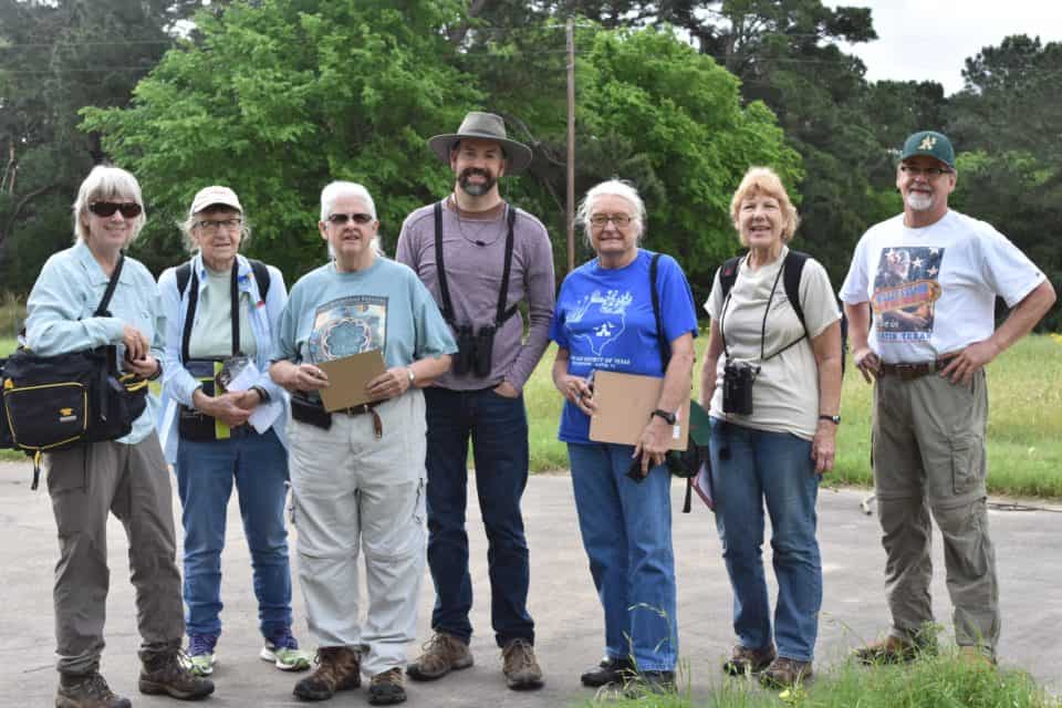 Group of seven people standing for a photo